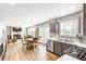 Modern kitchen featuring stainless steel appliances, granite countertops, and an adjoining dining area at 1194 Grandview Cir, Powder Springs, GA 30127