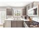 This kitchen offers stainless appliances, light countertops, plenty of cabinet space, and a view of the backyard at 1194 Grandview Cir, Powder Springs, GA 30127