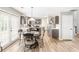 Well-lit kitchen featuring stainless steel appliances, modern countertops, and a breakfast nook with a round table at 1194 Grandview Cir, Powder Springs, GA 30127