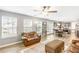 Open-concept living space with lots of natural light, leading to a modern kitchen at 1194 Grandview Cir, Powder Springs, GA 30127