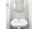 Small powder room featuring a pedestal sink and an oval mirror at 1194 Grandview Cir, Powder Springs, GA 30127