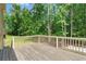 Wooden deck with railing and view of the wooded back yard at 1284 Brandl Dr., Marietta, GA 30008