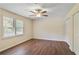 Comfortable bedroom featuring a ceiling fan, wood-look flooring, and a closet for ample storage at 1284 Brandl Dr., Marietta, GA 30008