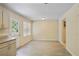 Cozy dining area with granite countertops, an adjacent door to the backyard, and bright natural light at 1284 Brandl Dr., Marietta, GA 30008