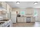 Well-lit kitchen featuring stainless-steel appliances, granite countertops and ample cabinet space at 1284 Brandl Dr., Marietta, GA 30008