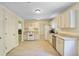 Bright kitchen features modern appliances, granite counters and woodgrain floors at 1284 Brandl Dr., Marietta, GA 30008