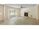 Inviting living room with a fireplace, ceiling fan, new flooring, and a large bay window at 1284 Brandl Dr., Marietta, GA 30008