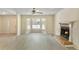Open-concept living room featuring a fireplace, new flooring, and a large window offering natural light at 1284 Brandl Dr., Marietta, GA 30008