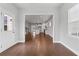 Open-concept living space with a kitchen, dining area, and a view to hardwood floors at 1640 Tide Mill Rd, Cumming, GA 30040