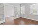 Bright office space with French doors, two windows, and neutral paint with hardwood flooring at 1640 Tide Mill Rd, Cumming, GA 30040