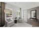Bright sitting room featuring neutral decor, hardwood floors, and large windows at 1640 Tide Mill Rd, Cumming, GA 30040