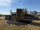Welcoming Klondike Reserve community sign with stone pillar and landscaped garden at 218 Seward St # 92, Conyers, GA 30094