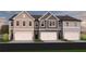 Modern townhome exteriors showcase unique color schemes, private garages, and well-maintained landscaping at 218 Seward St # 92, Conyers, GA 30094