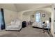 Spacious bedroom featuring multiple beds and a sitting area with natural light at 4581 Sagebrush Ct, Snellville, GA 30039