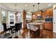 Well-appointed kitchen with stainless steel appliances, wood cabinets, granite countertops, and an adjacent dining area at 4581 Sagebrush Ct, Snellville, GA 30039