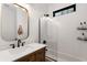 Modern bathroom with stylish fixtures, white subway tile, and a glass shower door at 212 Haralson Ne Ave, Atlanta, GA 30307