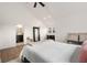 Bright primary bedroom featuring vaulted ceilings, ceiling fan, closet, and ensuite bathroom at 212 Haralson Ne Ave, Atlanta, GA 30307