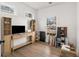 Bright bonus room with large windows, a TV, and light wood accents at 212 Haralson Ne Ave, Atlanta, GA 30307
