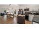 Open kitchen and living area with stainless appliances and a breakfast table at 212 Haralson Ne Ave, Atlanta, GA 30307