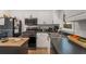 Bright kitchen features modern appliances, white cabinets, and sleek black countertops at 212 Haralson Ne Ave, Atlanta, GA 30307