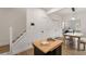 Open space features a staircase, dining area, and a movable island at 212 Haralson Ne Ave, Atlanta, GA 30307