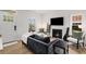 Cozy living room featuring natural light, a contemporary fireplace, and modern furnishings at 212 Haralson Ne Ave, Atlanta, GA 30307