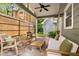 Relaxing covered patio with comfortable seating and a ceiling fan at 212 Haralson Ne Ave, Atlanta, GA 30307