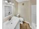 Clean bathroom featuring a sink with cabinet, toilet, and shower at 2190 River Heights Se Ct, Marietta, GA 30067