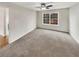 Spacious bedroom with plush carpeting and a large window overlooking the outdoors at 2190 River Heights Se Ct, Marietta, GA 30067