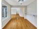 Bright dining room featuring hardwood floors and natural light from a large window at 2190 River Heights Se Ct, Marietta, GA 30067