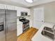 Well-lit kitchen with stainless steel appliances, white cabinets, and light countertops at 2190 River Heights Se Ct, Marietta, GA 30067