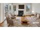 Staged living room featuring a fireplace, hardwood floors, and double doors to the outside at 2190 River Heights Se Ct, Marietta, GA 30067