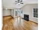 Bright living room featuring a fireplace, hardwood floors, and access to outdoor patio at 2190 River Heights Se Ct, Marietta, GA 30067
