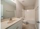 Traditional bathroom with a beige vanity, ample mirror, standard toilet, and shower/tub combo at 297 Edison Dr, Stockbridge, GA 30281