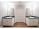 This bathroom features dual sinks with granite countertops and new fixtures at 297 Edison Dr, Stockbridge, GA 30281