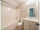 Well-lit bathroom with a shower-tub combo and single sink vanity at 297 Edison Dr, Stockbridge, GA 30281