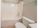 White bathroom with a shower-tub combo and standard toilet at 297 Edison Dr, Stockbridge, GA 30281