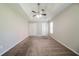 This spacious bedroom provides plush carpet and a ceiling fan at 297 Edison Dr, Stockbridge, GA 30281