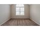 Bedroom featuring a vaulted ceiling and large window at 297 Edison Dr, Stockbridge, GA 30281