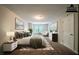This staged bedroom provides lots of light, carpeted floors, and a comfortable sitting area at 297 Edison Dr, Stockbridge, GA 30281