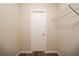 This carpeted closet features a wire shelf and access door at 297 Edison Dr, Stockbridge, GA 30281