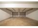 Two-car garage interior featuring concrete flooring and two metal doors at 297 Edison Dr, Stockbridge, GA 30281