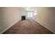 Cozy living room features carpeted floors, fireplace, and natural light at 297 Edison Dr, Stockbridge, GA 30281