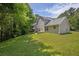 Spacious backyard with lush green grass and a view of the house at 3534 Oakshire Se Way, Atlanta, GA 30354