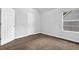 Bedroom with a closet, neutral paint, and a bright window at 3534 Oakshire Se Way, Atlanta, GA 30354