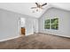 Spacious bedroom with vaulted ceiling, ceiling fan and an attached bathroom at 3534 Oakshire Se Way, Atlanta, GA 30354