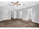 Bedroom features neutral carpet, white trim and multiple door ways at 3534 Oakshire Se Way, Atlanta, GA 30354