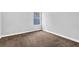 Bedroom featuring neutral walls, carpet, base molding, and window at 3534 Oakshire Se Way, Atlanta, GA 30354