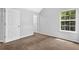 Bright bedroom with carpet and a large window for ample natural light at 3534 Oakshire Se Way, Atlanta, GA 30354
