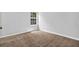 Clean and well-lit bedroom with plush carpet and a window at 3534 Oakshire Se Way, Atlanta, GA 30354